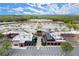 A bustling shopping plaza with diverse retail and dining options, highlighted by ample parking and lush landscaping at 5686 Lawley Dr, Alpharetta, GA 30022