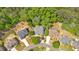 Aerial view of several homes including the property, showcasing mature trees and surrounding neighborhood layout at 6034 Addington Nw Dr, Acworth, GA 30101