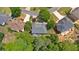 Aerial view of the property showcasing its landscaped yard, surrounding neighborhood, and mature trees at 6034 Addington Nw Dr, Acworth, GA 30101