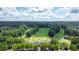 Picturesque aerial view of community golf course and lush green landscape on a sunny day at 6034 Addington Nw Dr, Acworth, GA 30101