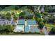 Stunning aerial view of community amenities including pool, tennis courts, and lush landscaping at 6034 Addington Nw Dr, Acworth, GA 30101