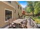 Back deck with a grill and outdoor seating, overlooking a well-maintained yard at 6034 Addington Nw Dr, Acworth, GA 30101