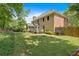 Spacious backyard of a two-story home, with a fenced perimeter and green grass at 6034 Addington Nw Dr, Acworth, GA 30101