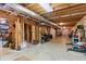 Spacious unfinished basement featuring exposed wooden beams and concrete walls at 6034 Addington Nw Dr, Acworth, GA 30101