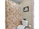 Cozy bathroom with a floral-patterned shower curtain at 6034 Addington Nw Dr, Acworth, GA 30101