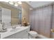 Full bathroom featuring a white vanity and shower with neutral-colored curtain at 6034 Addington Nw Dr, Acworth, GA 30101