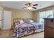Bedroom featuring twin beds, ceiling fan, and neutral wall color at 6034 Addington Nw Dr, Acworth, GA 30101