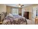 Bright bedroom with two beds, ceiling fan, and view to adjacent room at 6034 Addington Nw Dr, Acworth, GA 30101