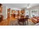 Dining area with hardwood floors, chandelier, and a doorway that leads to the kitchen at 6034 Addington Nw Dr, Acworth, GA 30101