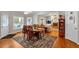Dining area open to living room, featuring natural light, and access to outdoor space at 6034 Addington Nw Dr, Acworth, GA 30101