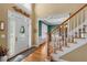 Inviting foyer featuring hardwood floors, a white front door with glass detailing and an open floorplan at 6034 Addington Nw Dr, Acworth, GA 30101