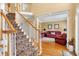 Elegant foyer with a staircase, hardwood floors, and a view into the adjacent living room at 6034 Addington Nw Dr, Acworth, GA 30101