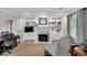 Cozy home office with built-ins, fireplace, and comfortable seating with natural light at 6034 Addington Nw Dr, Acworth, GA 30101