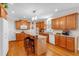 Spacious kitchen featuring wood cabinets, a breakfast bar, and modern appliances at 6034 Addington Nw Dr, Acworth, GA 30101