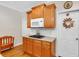 Cozy kitchen area with gas stove and custom wood cabinets for ample storage at 6034 Addington Nw Dr, Acworth, GA 30101