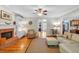 Inviting living room featuring hardwood floors, brick fireplace and comfortable seating arrangement at 6034 Addington Nw Dr, Acworth, GA 30101
