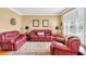 Cozy living room featuring hardwood floors, neutral paint, classic furniture and natural light at 6034 Addington Nw Dr, Acworth, GA 30101