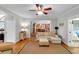 Cozy living room with hardwood floors offering seamless transition into the kitchen area at 6034 Addington Nw Dr, Acworth, GA 30101