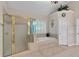 Bright, spacious main bathroom features a garden tub and a glass-enclosed shower at 6034 Addington Nw Dr, Acworth, GA 30101