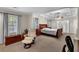 Oversized main bedroom with comfortable seating and a beautiful tray ceiling at 6034 Addington Nw Dr, Acworth, GA 30101