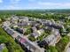 Wide aerial shot of the Ivy Walk community, surrounded by lush greenery and trees at 2260 Edgartown Se Ln # 1, Smyrna, GA 30080