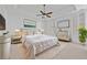 Bright bedroom featuring a ceiling fan, windows with blinds, a dresser, and stylish decorations at 2260 Edgartown Se Ln # 1, Smyrna, GA 30080