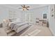 Cozy bedroom with carpet flooring, double windows, a ceiling fan, and natural lighting at 2260 Edgartown Se Ln # 1, Smyrna, GA 30080