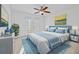 Bright bedroom with a double bed, ceiling fan, and double doors that lead to a balcony at 2260 Edgartown Se Ln # 1, Smyrna, GA 30080