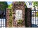 Ivy-covered brick entrance sign for One Ivy Walk, established in 2004 at 2260 Edgartown Se Ln # 1, Smyrna, GA 30080