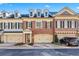 Charming brick townhome featuring dormer windows and attached two-car garage at 2260 Edgartown Se Ln # 1, Smyrna, GA 30080