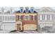 Charming brick townhome featuring dormer windows and attached two-car garage at 2260 Edgartown Se Ln # 1, Smyrna, GA 30080