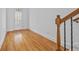 Entryway with a wood floor, staircase with wooden railing, and a glass panel door at 2260 Edgartown Se Ln # 1, Smyrna, GA 30080