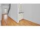 Hallway with hardwood floors, stairway with wrought iron railing, and built in cabinets at 2260 Edgartown Se Ln # 1, Smyrna, GA 30080