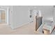 Upstairs hallway features carpet flooring, a banister, and built-in shelving at 2260 Edgartown Se Ln # 1, Smyrna, GA 30080