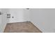 Simple laundry room with tile flooring, utility hookups, and clean white walls at 2260 Edgartown Se Ln # 1, Smyrna, GA 30080
