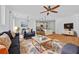Open concept living room with kitchen, hardwood floors, and ample natural light at 2260 Edgartown Se Ln # 1, Smyrna, GA 30080