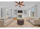 Bright living room with fireplace, built-in shelving, ceiling fan, and comfortable seating at 2260 Edgartown Se Ln # 1, Smyrna, GA 30080