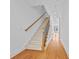 Staircase featuring carpeted stairs, hardwood floors, and wrought iron balusters at 2260 Edgartown Se Ln # 1, Smyrna, GA 30080