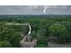 Aerial view of 2497 Lakewood surrounded by mature trees with a view of Atlanta's skyline at 2497 Lakewood Sw Ave, Atlanta, GA 30315
