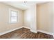 Bedroom with neutral walls, wood-look floor, and natural light from the window at 2497 Lakewood Sw Ave, Atlanta, GA 30315
