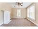 Bright living room featuring a white fireplace and large windows for natural light at 2497 Lakewood Sw Ave, Atlanta, GA 30315