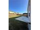 Large backyard with lawn, concrete patio, and pergola perfect for entertaining at 5452 Fountainhead Ln, Auburn, GA 30011