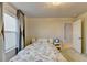 Comfortable bedroom with a cozy bed, side table, and window, creating a relaxing and inviting space for rest and relaxation at 5452 Fountainhead Ln, Auburn, GA 30011
