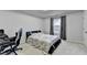 Nicely decorated bedroom with neutral carpet and a large window at 5452 Fountainhead Ln, Auburn, GA 30011