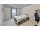 Cozy bedroom with neutral carpet and walls with a window view of the neighborhood at 5452 Fountainhead Ln, Auburn, GA 30011