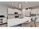Bright kitchen with white cabinets, quartz countertops, and stainless steel appliances at 5452 Fountainhead Ln, Auburn, GA 30011