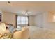 Bright living room with a cozy sofa, plush chair, and large window with curtains, creating an inviting and spacious atmosphere at 5452 Fountainhead Ln, Auburn, GA 30011