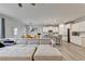 A spacious living room is connected to dining and kitchen areas, offering an open and airy feel at 5452 Fountainhead Ln, Auburn, GA 30011