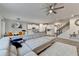 Open living space showcases a large sectional sofa, dining area, kitchen, and staircase at 5452 Fountainhead Ln, Auburn, GA 30011