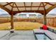 Patio view with comfortable seating underneath the pergola, perfect for entertaining at 5452 Fountainhead Ln, Auburn, GA 30011